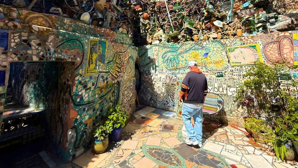 "Visitor exploring the Magic Gardens maze"
