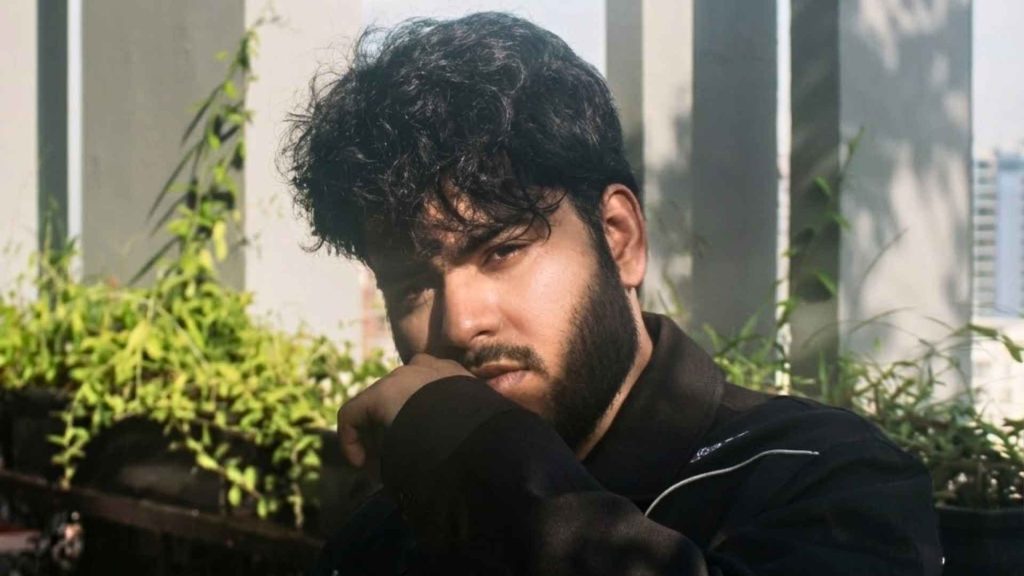 Close-up portrait of Shitom Ahmed looking confidently into the camera, symbolizing his global Bangla pop ambition.