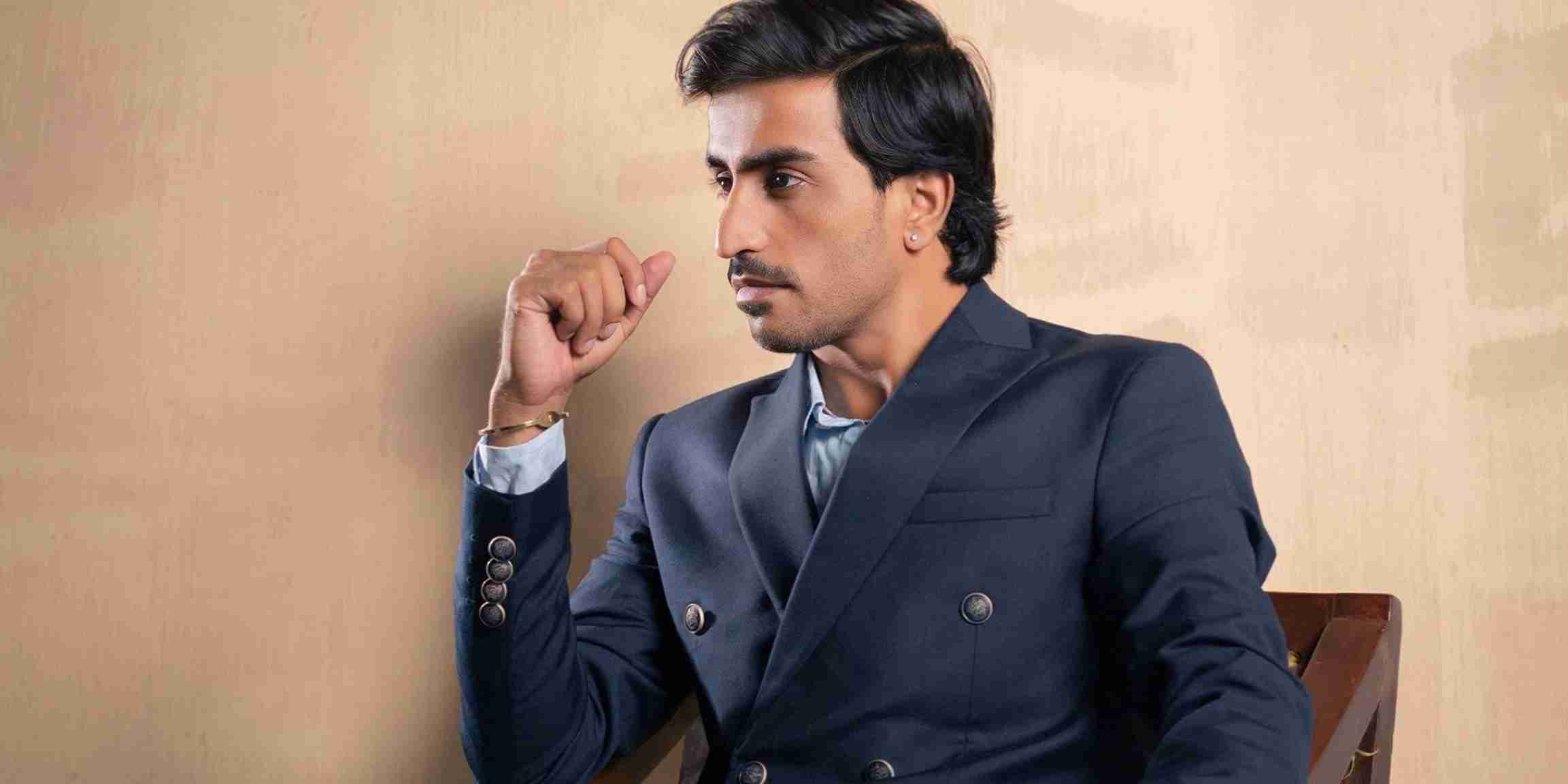 Pakistani actor Jam Emran portrait with cinematic lighting.