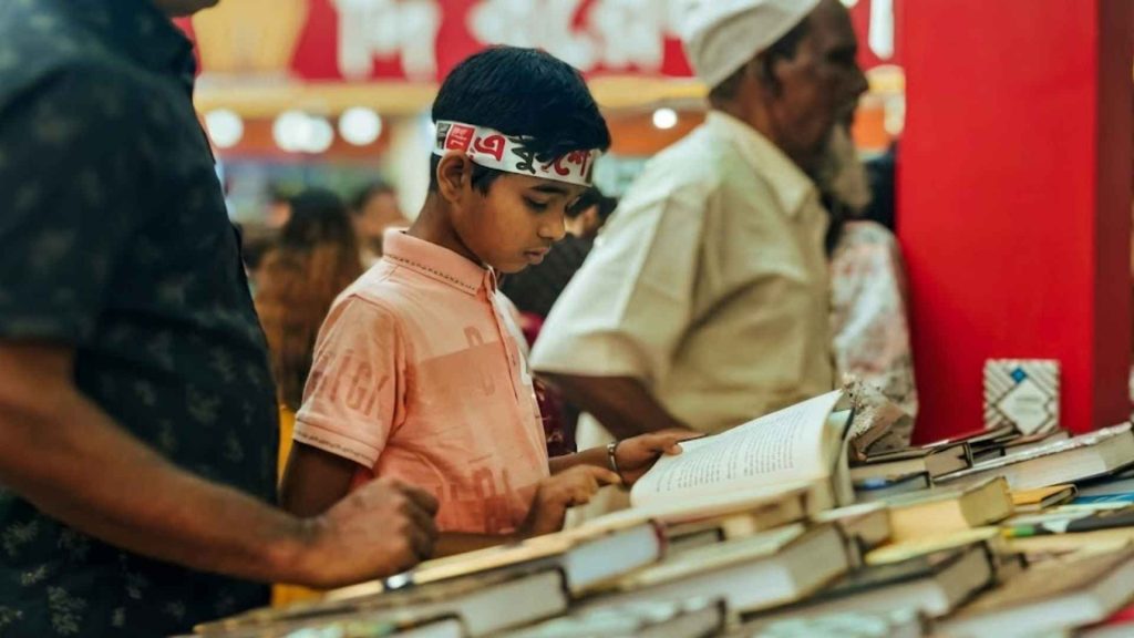 Young reader at Ekushey Book Fair during International Mother Language Day Bangladesh 2026 celebration