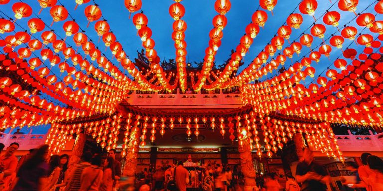 Step into the Glow: Experience the Magic of Traditional Lantern Festivals at the Brooklyn Lunar New Year Parade 2026, featuring thousands of glowing red Chinese lanterns.