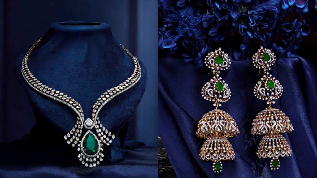 Luxury emerald teardrop bridal necklace and heavy gold jhumka earrings from Malabar Gold & Diamonds.