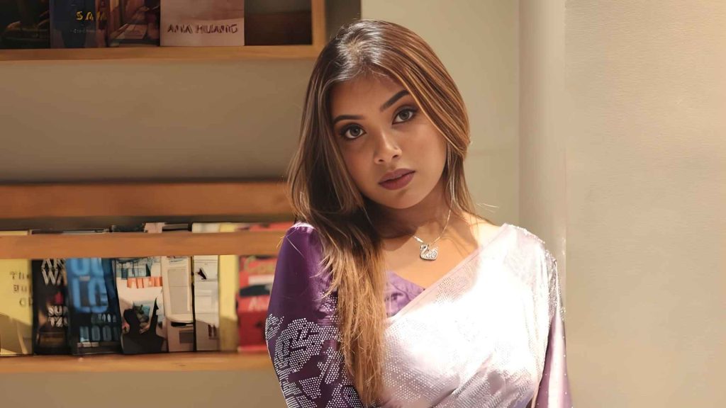Anica Khan in a black saree, blending culture, creativity, and artistry in her work
