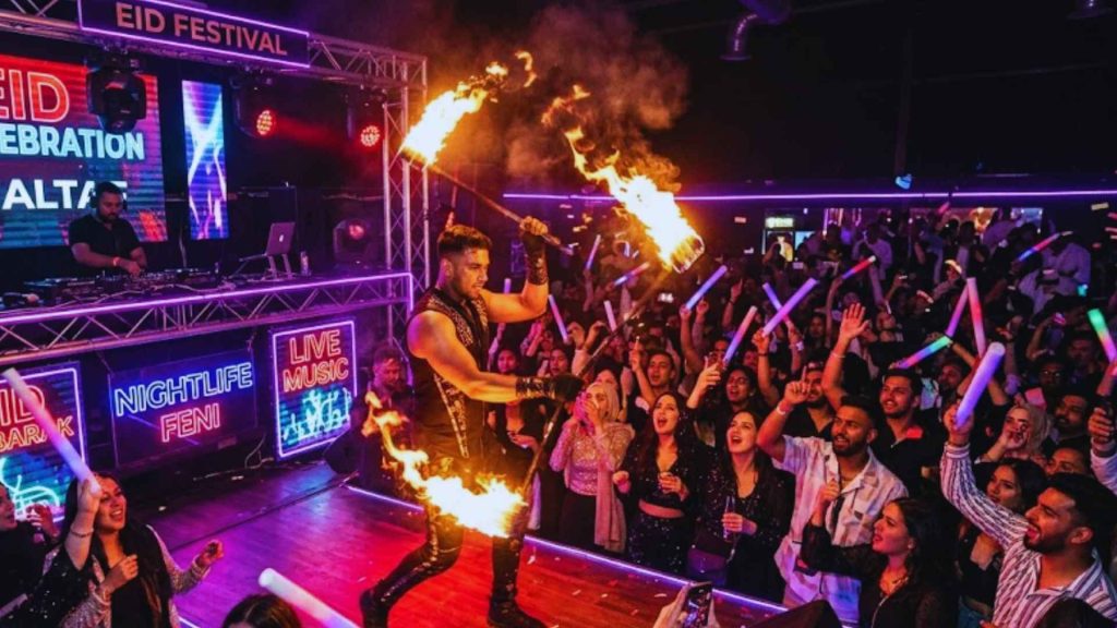 A professional performer hosting a live fire show on stage during the Neon Eid Party 2026 celebration in a vibrant New York City nightclub.