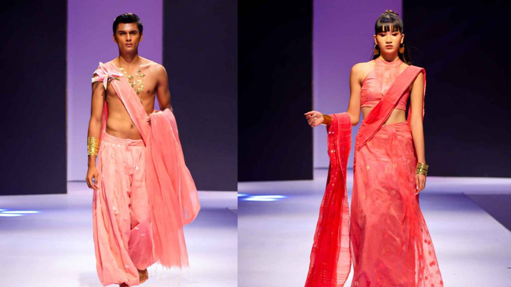 Male and female models showcasing pink and nectar-toned structural drapes from the Asad Sattar Ami Dhaka Colombo Fashion Week runway.