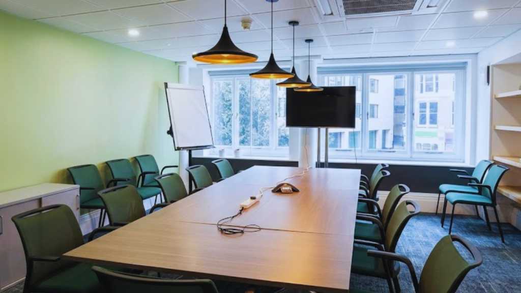 A prestigious classical office lobby with a grand staircase, showcasing the heritage of established London Law Firms for UK-South Asia