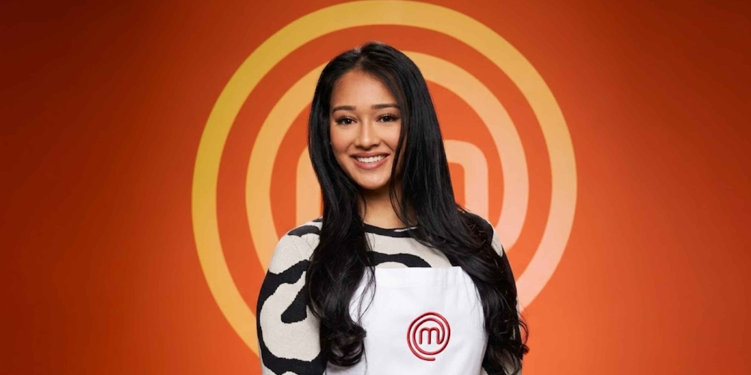 Professional portrait of Shompa Kabir MasterChef wearing the iconic white apron in front of the MasterChef logo.