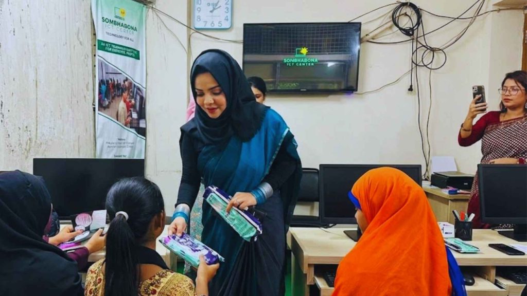 Organizers conducting a community workshop and awareness session by a riverbank in preparation for the Qurbani Eid Exhibition by Glamshow.
